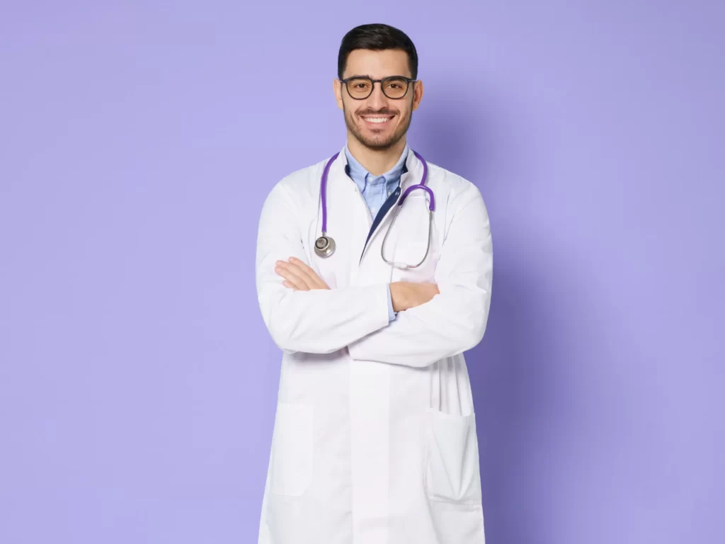smiling man in lab coat with stethoscope utc